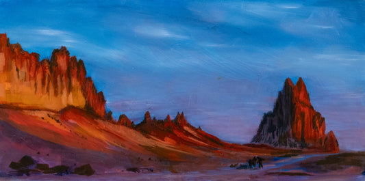 Oil Painting Desert Shiprock New Mexico landscape with rocky formations under a blue sky with a fiery sunrise hiting the mountains